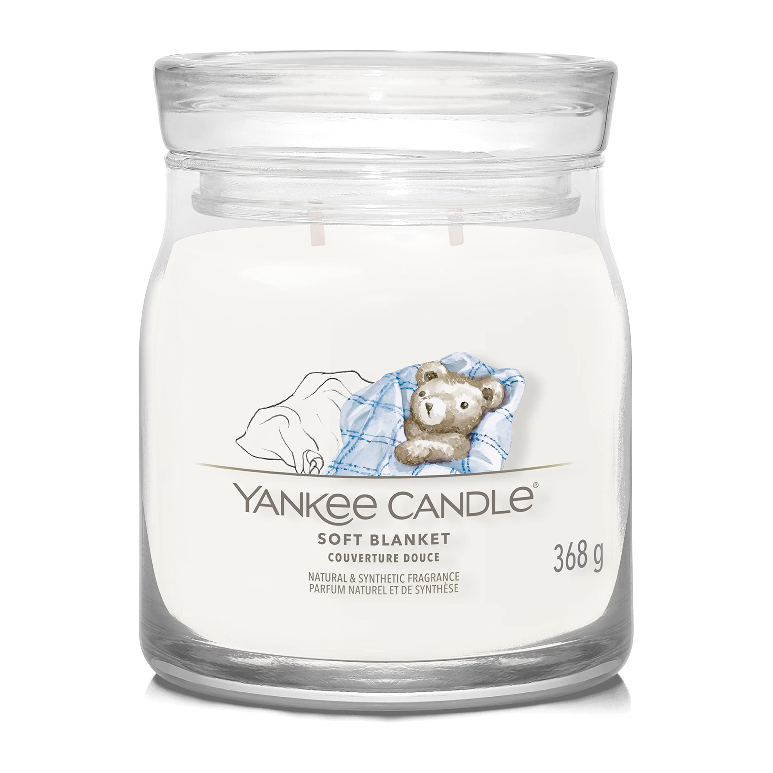 YANKEE CANDLE JAR SOFT BLANKET 368G Giara media Yankee Candle "Soft Blanket" da 368 g: fragranza avvolgente su base di ambra, cacao e muschio. Vaso in vetro con etichetta illustrata e...